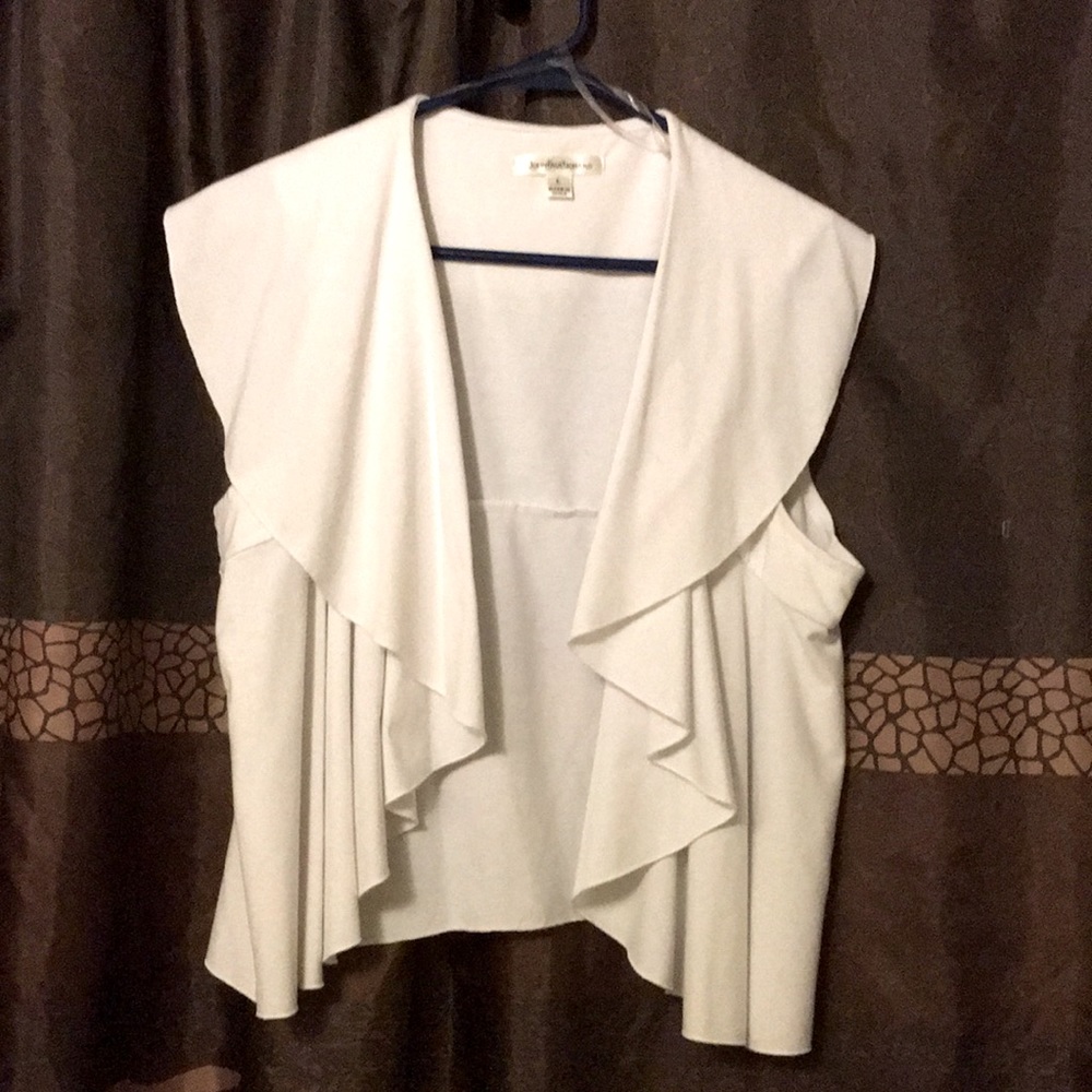White vest like top would be very cute layered with a long or short sleeve top
